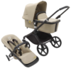 Bugaboo Fox Cub kinderwagen in Desert Beige met zwart frame en grote wielen.